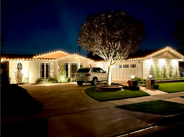 christmas light installers in irvine with house decorated in lights